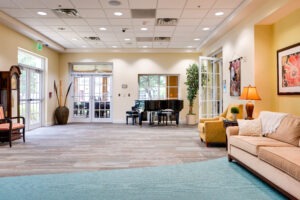 lounge area with sofas and a piano