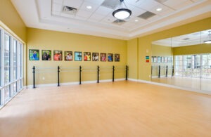 aerobics room with large windows and mirrors