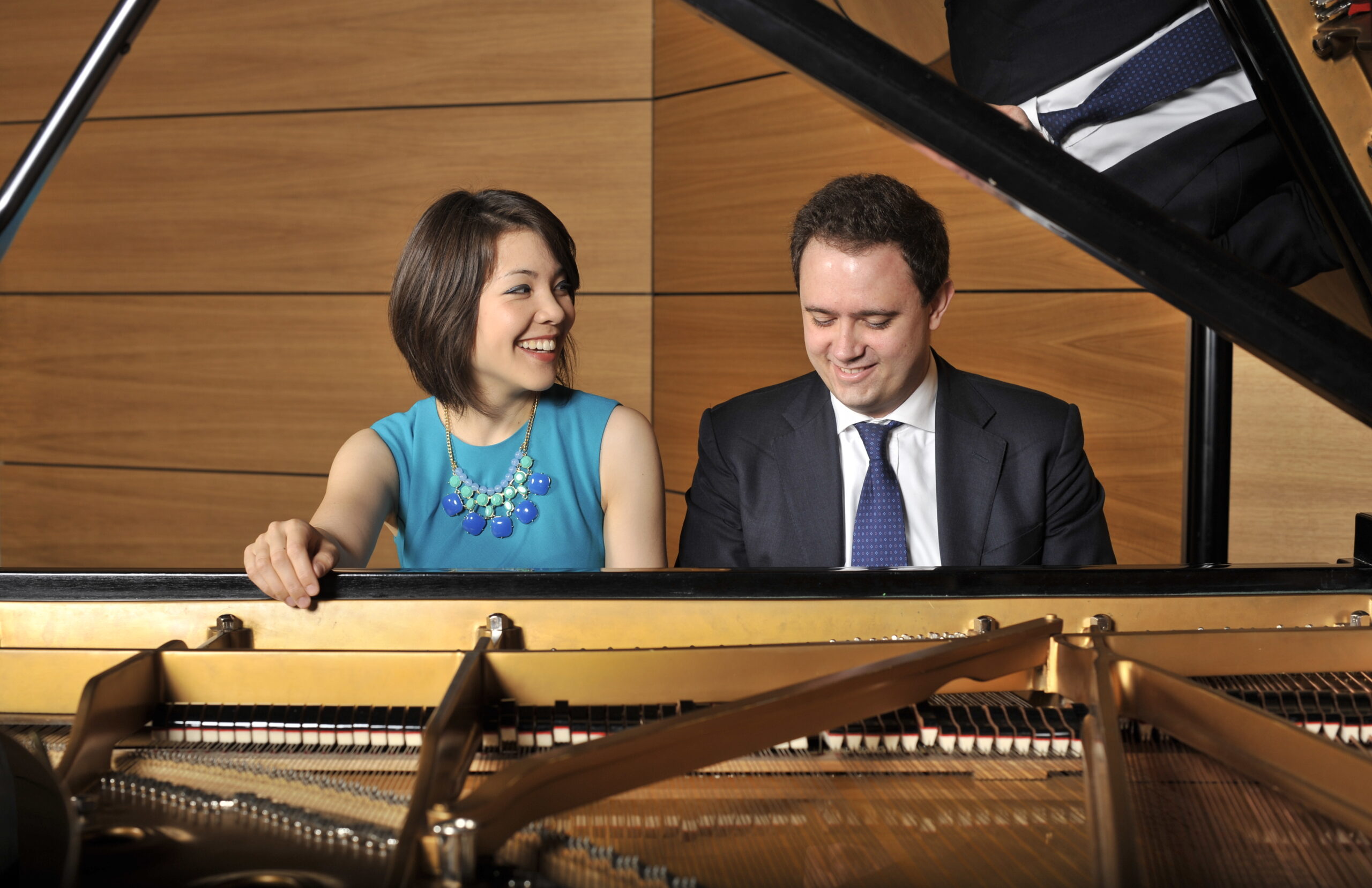 two pianists playing the piano